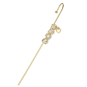 Detail of gold LOVE ear crawler with sparkling zircons and a small heart charm pendant