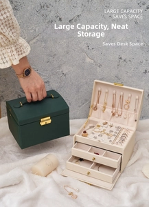 Detail view of a 3-layer drawer jewelry organizer with necklace hooks and velvet lining