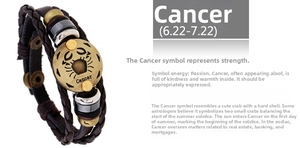 Detail of woven brown leather bracelet with bronze Cancer zodiac sign and metal beads