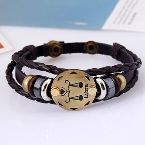 Close-up detail of the Libra zodiac leather bracelet with antique bronze alloy plaque