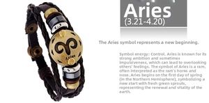 Detailed macro view of an Aries zodiac braided leather bracelet with vintage bronze beads