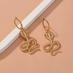 Retro gold cobra snake hoop earrings with detailed metal scale texture and elegant curves