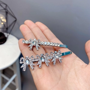 Elegant silver bow hair clip set with sparkling rhinestones and crystal bowknot accents