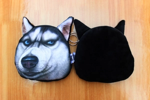 Detailed view of plush Husky coin purse showing digital print face and black back