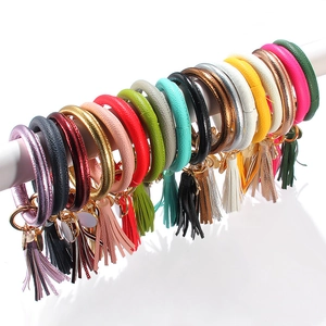 Detailed assortment of colorful PU leather tassel wristlet keychains in various metallic shades