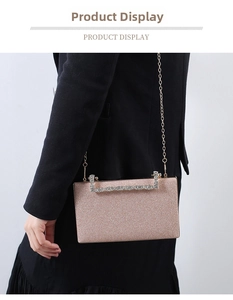 Macro detail of rose gold glitter evening bag with rhinestone handle and gold chain