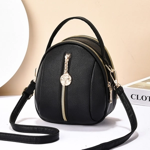 Chic black mini backpack and crossbody bag featuring rose gold zippers and pebble leather