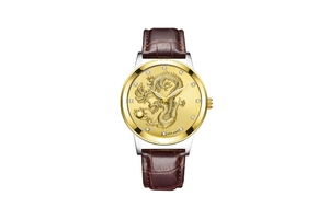 Detail of the golden dragon relief dial with crystal markers on the leather watch