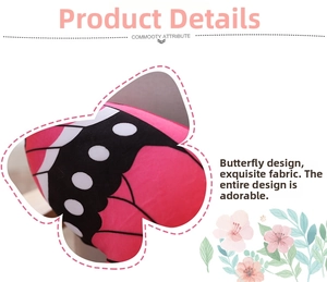 Macro shot of realistic butterfly plush cushion with vibrant pink fabric and wing texture