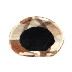 Detail of plush plaid bucket hat showing internal black lining and adjustable drawstring