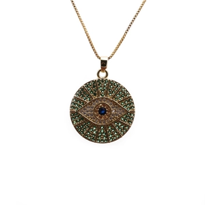 Golden Evil Eye necklace with green zircon starburst and blue enamel eye pendant