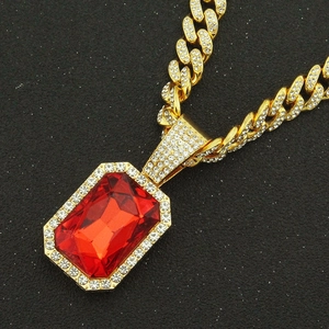 Hip hop gold Cuban chain necklace with large ruby pendant surrounded by clear crystals