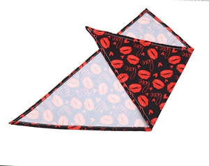 Detail of red heart and love pattern print on a black pet triangle scarf for dogs