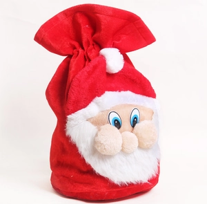 Detail of red plush Christmas gift bag with 3D Santa Claus face and drawstring closure