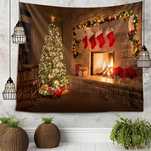 Detail of Christmas wall tapestry featuring a warm fireplace and lit tree on a grey wall