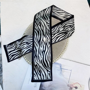Detail of zebra print satin hair ribbon on a luxury tray for a chic fashion accessory look
