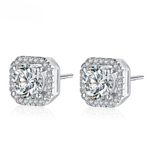 Detailed view of silver square halo stud earrings featuring round cubic zirconia stones