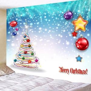 Christmas tapestry with blue spiral tree and star ornaments over a white bed headboard