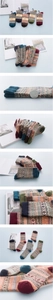 Close-up of five pairs of vintage ethnic wool socks in diverse colors and patterns