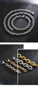Detailed close-up of polished silver and gold O-chain necklace set with lobster clasps