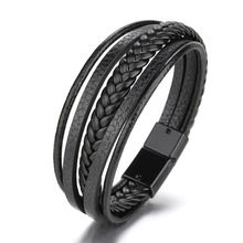 Close-up of black braided leather multi-layer bracelet with magnetic metal clasp