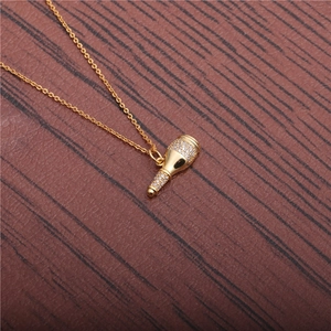 Elegant gold necklace with a sparkling champagne bottle pendant inlaid with zircons