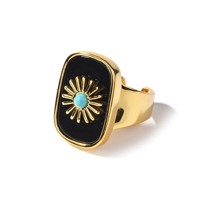 Adjustable gold ring with black rectangular face and sunburst turquoise stone center