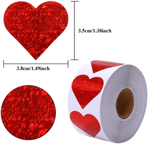 Detailed view of red heart and round laser stickers with size labels and holographic finish