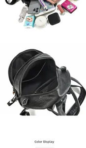 Internal view of black leather backpack showing multiple compartments and storage capacity