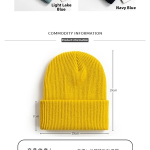 Detailed close-up showing the fine ribbed texture and 7cm cuff of the yellow knit beanie