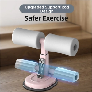 Detail of pink sit-up assistant device with stable suction cup and foam leg supports