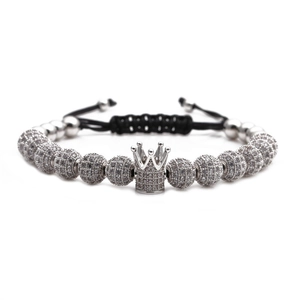 Adjustable woven bracelet featuring silver crown charm and micro-pave zircon beads