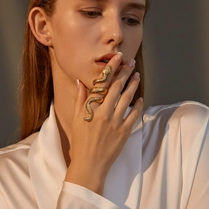 Detailed view of a textured golden snake-shaped wrap ring with lifelike scales and spiral design