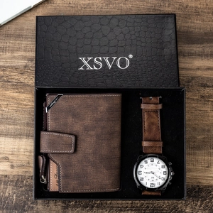 Close-up of a men's gift set featuring a brown leather wallet and watch in a black box