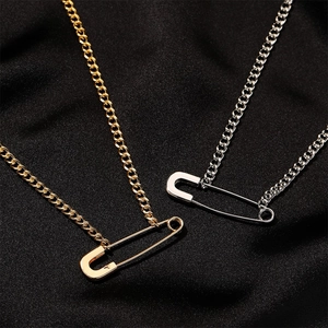 Minimalist paperclip pendant necklace in gold and silver finishes on black silk