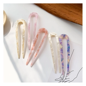Five assorted marble acetate U-shaped hair pins in elegant pastel colors for daily styling