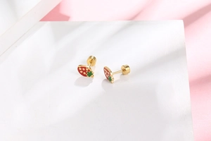 Detail of red strawberry earrings with secure screw back closure in gold-plated steel