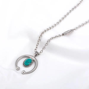 Silver vintage tribal steel necklace with crescent pendant and green turquoise stone