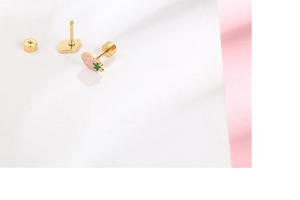 Close-up of pink strawberry stud earrings with green leaf details and screw back design