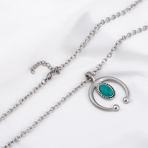 Retro hip-hop silver steel necklace featuring an oval turquoise pendant on white silk