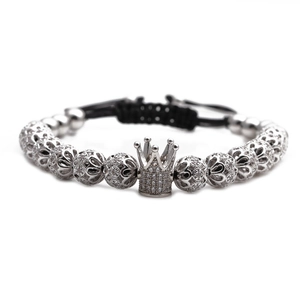 Adjustable crown charm bracelet with pavé cubic zirconia and black braided cord design