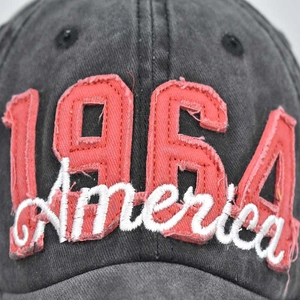 Close-up of vintage grey washed denim baseball cap with 1964 America 3D embroidery detail