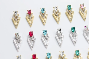 Detailed close-up of V-shape alloy nail art charms with colorful teardrop rhinestones