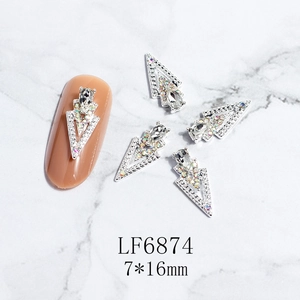 Detailed view of 7x16mm 3D hollow triangle nail art alloy charms with AB rhinestones