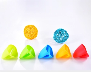Five colorful silicone mini oven mitts in various shades arranged on a white background