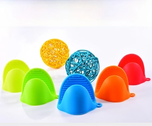 Silicone shark pinch mitts in various colors with non-slip ridges and hanging holes