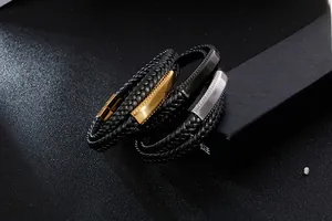 Detailed close-up of double-layer braided leather bracelets with gold, silver, and black clasps