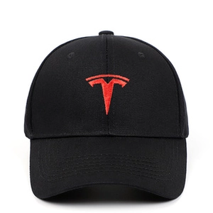 Close-up of red brand logo embroidery on high-quality washed cotton black baseball cap