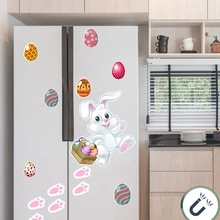 Magnetic Easter bunny stickers and colorful eggs displayed on a refrigerator surface