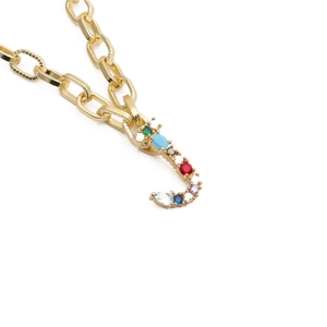 Close-up of golden letter J pendant necklace with vibrant multi-color zircon stones